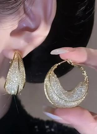 Оригінальні золотисті сережки
