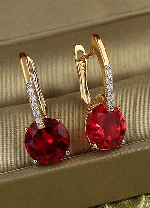 Сережки xuping jewelry стрілка з родієм із великим малиновим каменем 2,7 см золотисті