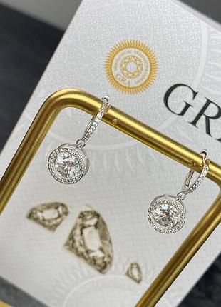 Сережки з підвіскою “рухомий камінчик moissanite”