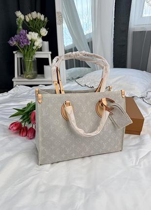 Louis vuitton onthego pm in blue-gray monogram denim