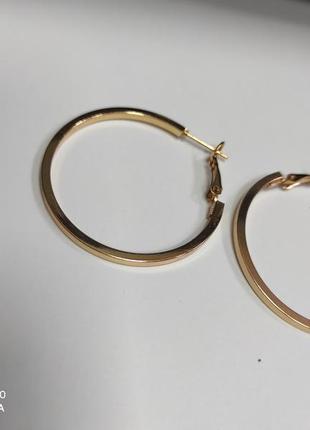 Шикарні сережки кільця під золото3 фото