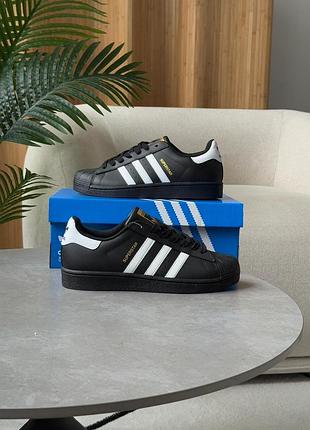 Adidas superstar black white gold logo
