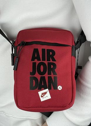 Сумка через плече jordan jumpman у червоному кольорі.