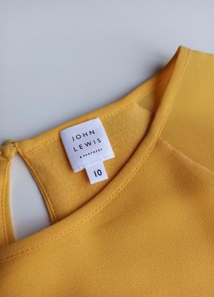Красива стильна однотонна жовта блуза з модним оригінальним рукавом7 фото