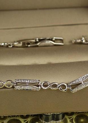 Браслет xuping jewelry прямоугольные звенья с тройными колечками с белыми камнями 21 см 5 мм серебристый