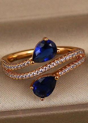 Кольцо xuping jewelry встречные капли с синими камнями р 19 золотистое love-shopping