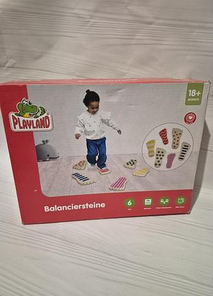 Набор деревянных балансирующих камней playland для детей, разработанный для тренировки равновесия и координации.