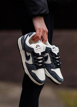 Nike sb dunk low x kaws white blue