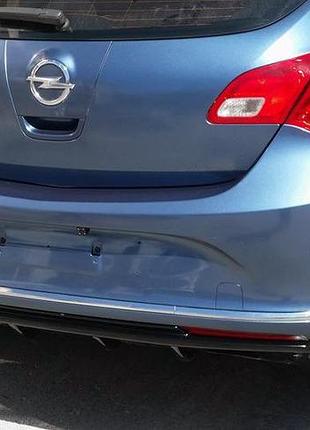 Накладка на задний диффузор (грунтованная под покраску) для opel astra j 2009-2015 гг