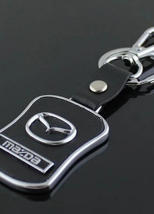 Брелок с логотипом авто mazda, карабин и кольцо, металический со вставками натуральной кожи