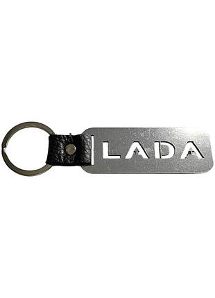 Брелок с метала и названием марки lada