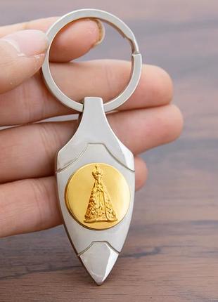 Брелок-оберіг богородиця апаресіда (nossa senhora aparecida), металевий, сріблясто-золотистий