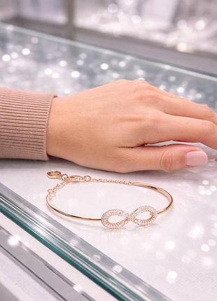 Браслет swarovski hyperbola infinity жіночий оригінал золотистий з камінням браслет swarovski hyperbola infinity женский оригинал золотистый с камнями