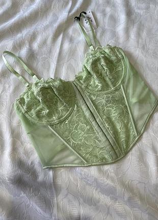 Primark  80 d ніжний салатовий корсет(чашки з кісточками) на застібках «крючках»  спереді і на спинці; розмір (еur) 80d на вузьких бретельках