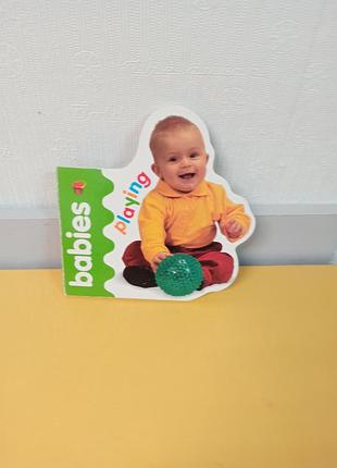 Детская развивающая книга "playing babies",