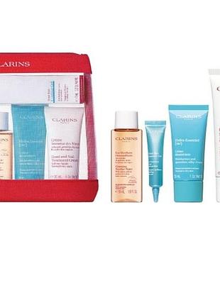 Набор косметики clarins travel body care set  для ухода за кожей лица, рук и тела /14586/
