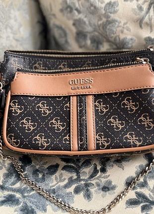 Продам сумку guess alexie double pouch в кориневому кольорі. сумка в дуже хорошому стані.