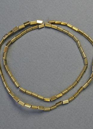 Бусины гематит треугольник цвет золото d-5х2мм+- l-42см+- низка