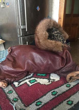 Шкіряний натуральний комбінезон з капюшоном, обробленим хутром норки.