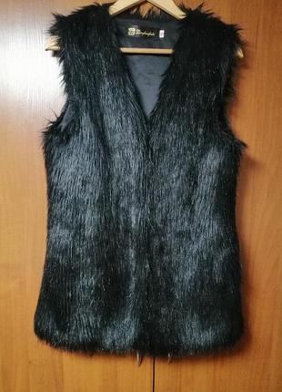 Жилетка, безрукавка