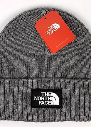 Зимова шапка the north face з чорним логотипом, колір темно-синій сірий