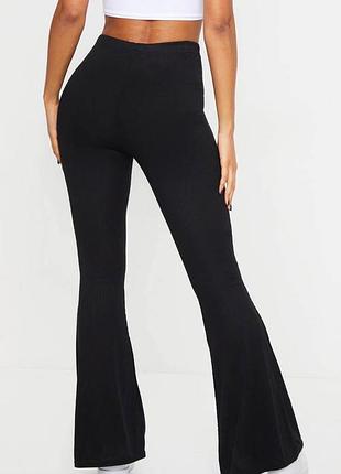 Prettylittlething трикотажні розкльошені штани