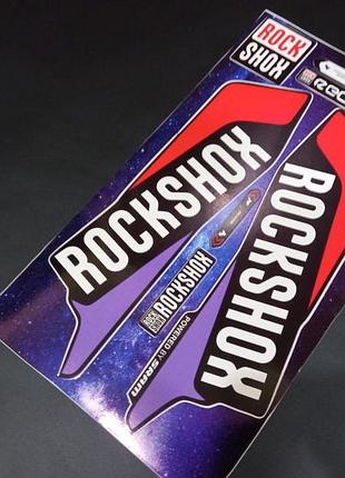 Червона з фіолетовим наклейки на вилку пір'я рок-шок шок rock shox велосипеда recon рекон ключка