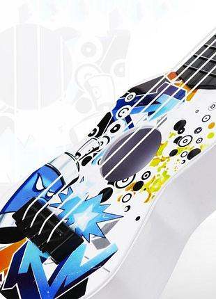 Игрушка маленькая детская гитара 25 см 6