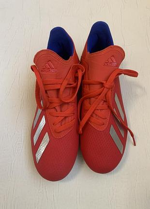 Дитячі футбольні бутси adidas x 18.3 fg junior у кольорі "active red / silver met. / bold blue".