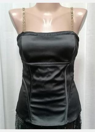 Топ - корсет жiночий,
бренд - манго,
черного цвета из ткани состава:
54% cotton, 43% poliester, 3% elastane, подклад - 100%- выскоза. размир м.