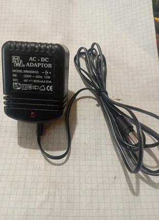 Трансформаторний адаптер живлення марки mastak, модель mw608gs, з вихідною напругою 6 вольт.
