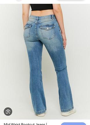 Джинсы кльош від коліна/буткат tally weijl xs