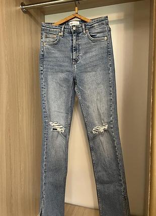 Джинси zara розклешені з розрізами знизу