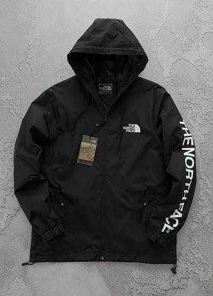 Ветровка tnf белого. а черного цвета