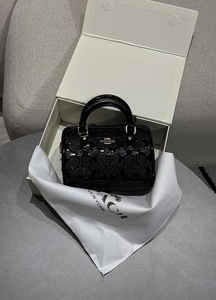 Сумка coach mini rowan crossbody in signature patent black leather