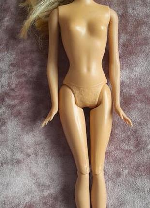 Оригінальна барбі  на шарнірах  від mattel
лялька продається без одягу (нюд).