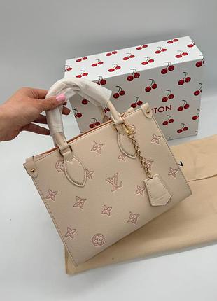 Louis vuitton onthego pm monogram empreinte beige / peach 25x19