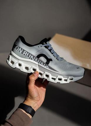 On cloudmonster 2 running white/grey 8