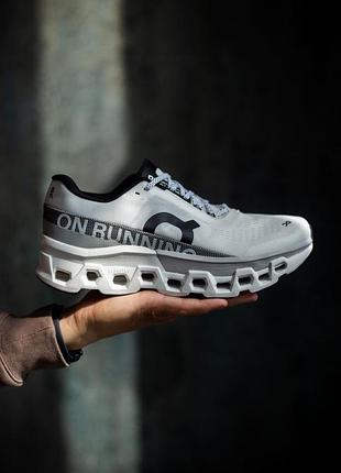 On cloudmonster 2 running white/grey 5