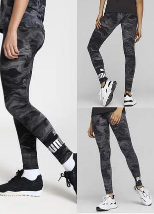Жіночі спортивні легінси puma ess+ marbleized leggings у чорному/сірому кольорі з абстрактним мармуровим принтом.