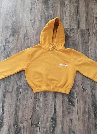Гірчично-жовте укорочене худі від бренду ellesse.