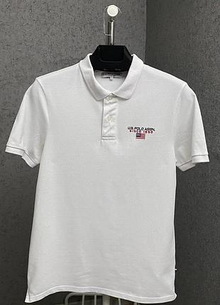 Біла футболка поло від бренду u.s. polo assn