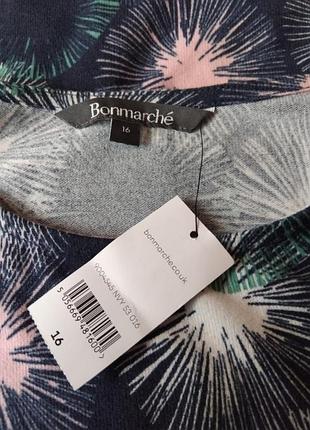 Плаття фірми bonmarche, нове. трикотажний поліестер з еластичною, розмір 16 (48-50), колір темно-синій із яскравим малюнком. дві накладні кишені,