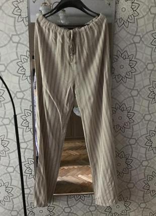 Літні бежеві штани у смужку