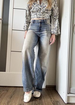 Класичні джинси  (wide-leg jeans) з вінтажним ефектом потертості