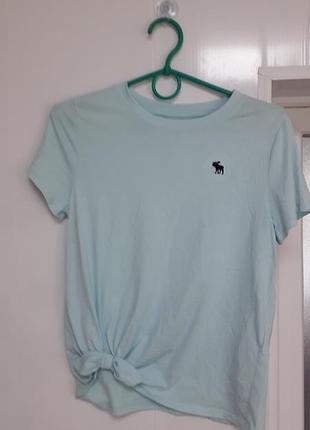 Abercrombie  kids
11-12
36/ s/44
женская хлопковая футболка голубого цвета, сбоку завязка бант.
идеальное состояние, состояние новой