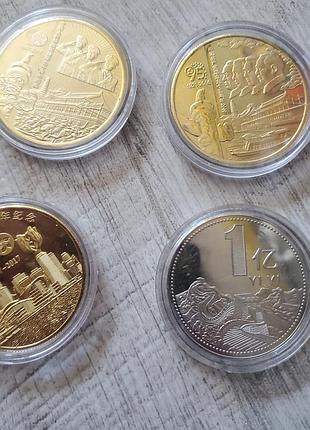 Набор монет китайских юбилейних новие в коробочка пластикових