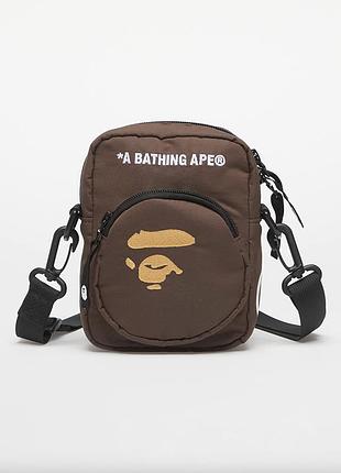 Сумка через плече bape у коричневому кольорі. a bathing ape ape head mini bag.