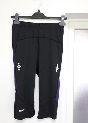 Inoc 
40/l/48
женские укороченные спортивные лосины черного цвета с фиолетовыми вставками (сеточка)
очень хорошее состояние
