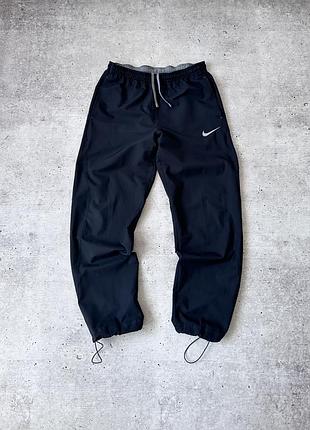Спортивні штани на утяжках nike black cargo style windpants drawstring ankle hem warm up pants mens size m